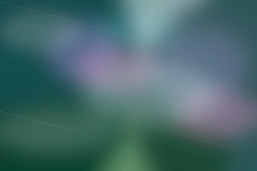 Teal and purple clouds drift in a dreamy blur with faint diagonal streaks, creating a serene, futuristic mood for wallpapers or creative campaigns. © Sergei