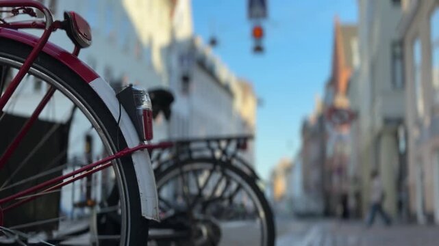 Copenhagen city street with people riding bicycles, Denmark