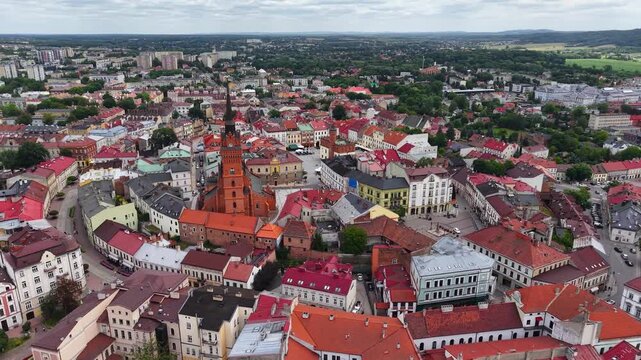 Flight over Cathedral Basilica and historic old town cityscape in Tarnow, Poland