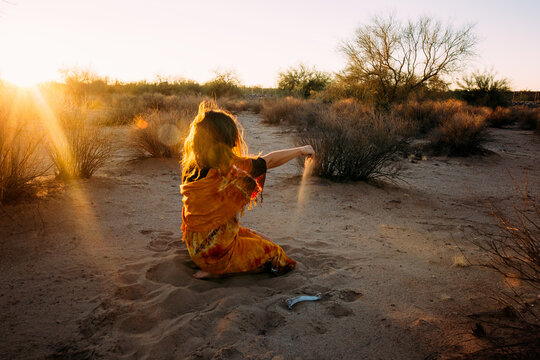 woman in desert during sunset