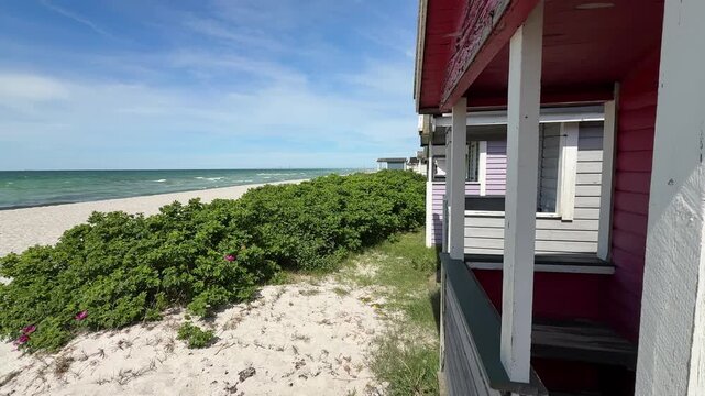 Coastline view of traditional beach huts in Skanor, Sweden