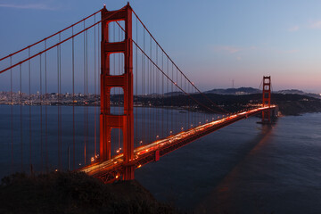 Close-up Golden Gate Bridge at twilight viewed from northern cliffs © Pete Niesen Photo