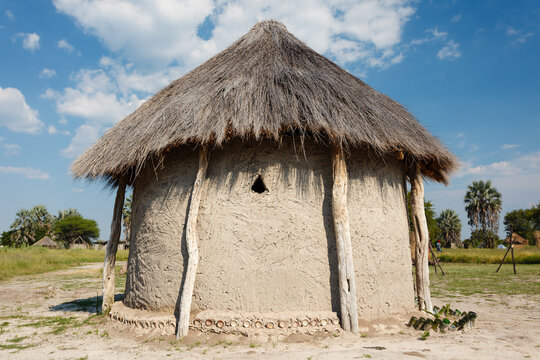 Closeup of traditional native mud hut with small window in Botswana, Africa.