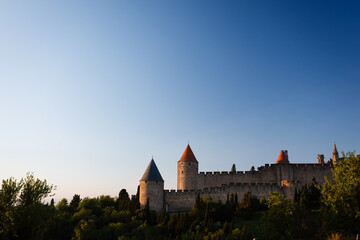 Sunlight highlights the castle turrets in the medieval walled city © Pete Niesen Photo