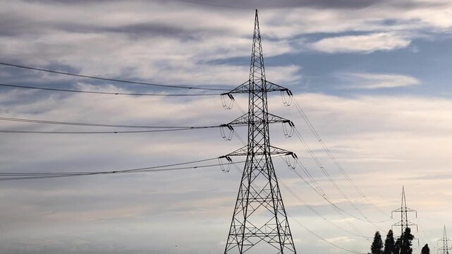 High Voltage Power Lines and Electricity Pylons at Sunset 180fps Captured in Cinematic High Detail Footage
