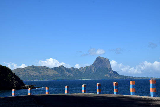 A distant view of the "Jurassic Park-style" hills on Nuca Molas, West Manggarai, Indonesia&mdash;featuring beautiful nature, clear waters, and stunning natural scenery.
