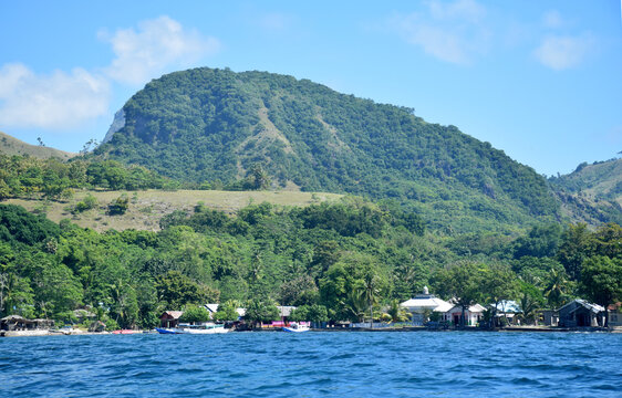 A beautiful view of a remote settlement amidst clear waters on Nuca Molas Island, West Manggarai, Flores, Indonesia