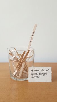 Direct Channel Message on Wooden Stirrer in Glass with Inspirational Quote for Low Attention Span