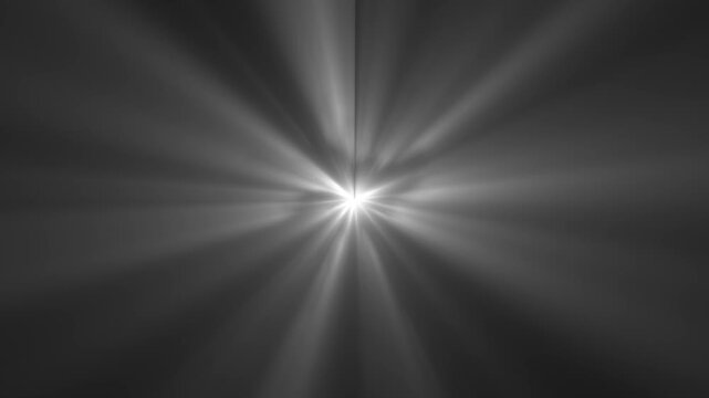 Shining sun light rays lens flares animation footage. Smooth appearance of light lens flare. Dramatic light rays emanating on black background. Sun rays perspective view and light beams streaming.