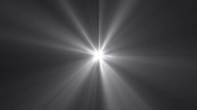 Shining sun light rays lens flares animation footage. Smooth appearance of light lens flare. Dramatic light rays emanating on black background. Sun rays perspective view and light beams streaming.