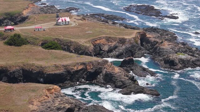 View aerial shots of Point Cabrillo Lighthouse and the rugged coastal landscape near Mendocino and Fort Bragg in California.