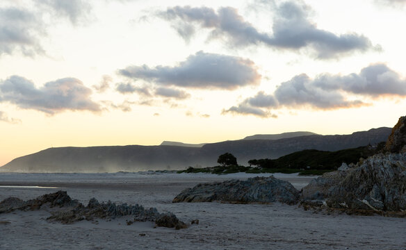 low tide at sunset and dusk, Grotto Beach, Hermanus, South Africa