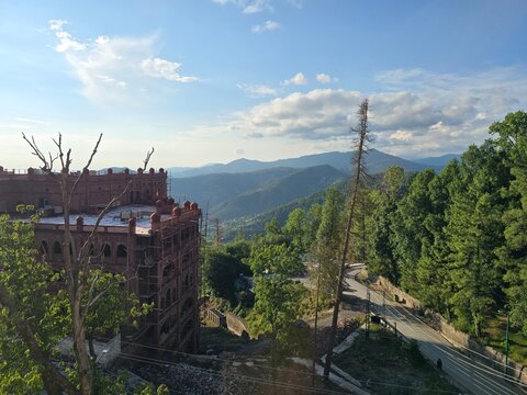 Historic Colonial Building Overlooking the Lush Hills of Murree, Pakistan with Timeless Mountain Architecture and Scenic Valley Views
