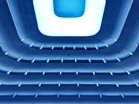 Blue concentric square layers forming optical tunnel of depth, soft gradient lighting and textured.