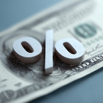 percentage symbol with up and down arrows on dollar bill interest rate control concept