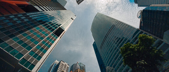 Business City Skyscrapers From Street Level Perspective Overlooking Modern Glass Towers In Downtown in singapore © Towfiqu Barbhuiya 