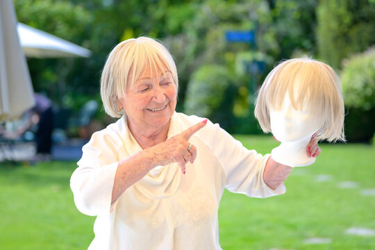Senior Woman Choosing Blonde Wig