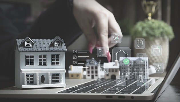 Buying real estate online: Woman choosing a miniature model house on a laptop with virtual smart home and mortgage icons.