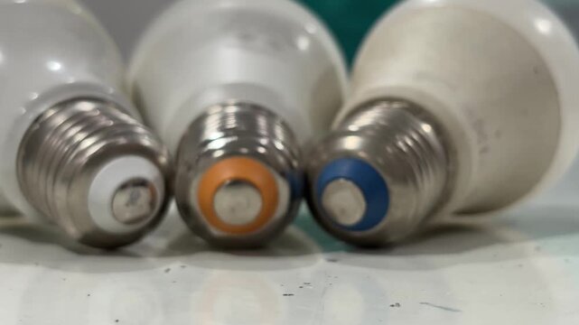 Close-up view of a few old Edison screw light bulb lying on a tabletop. Electricity concept.