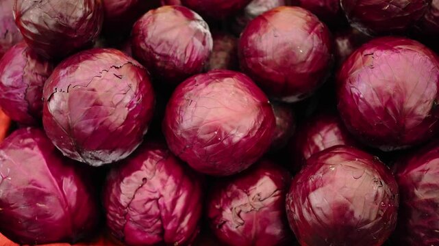 Red onions stacked in a market display