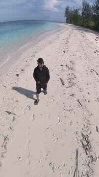 Man Walking on Tropical Beach