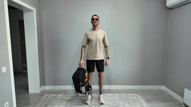 Creative stop-motion style video showing a man getting dressed for a journey. He starts in underwear, jumps, and lands fully dressed