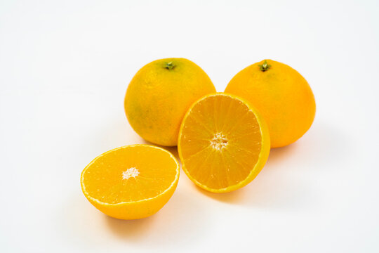 Fresh oranges on a white background