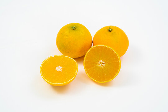 Fresh oranges on a white background