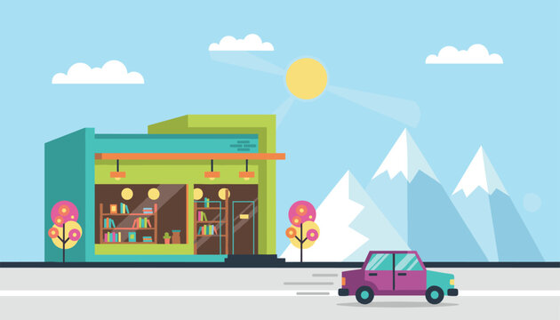 Cozy local bookstore building exterior in a scenic landscape with a car parked in front on a clear sunny day.