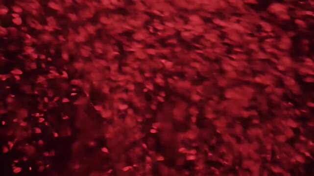 Abstract red textured background with bokeh effect.