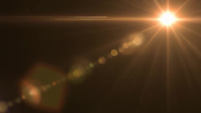 Golden Lens Flare Transition with Subtle Bokeh During Cinematic Lighting Reveal