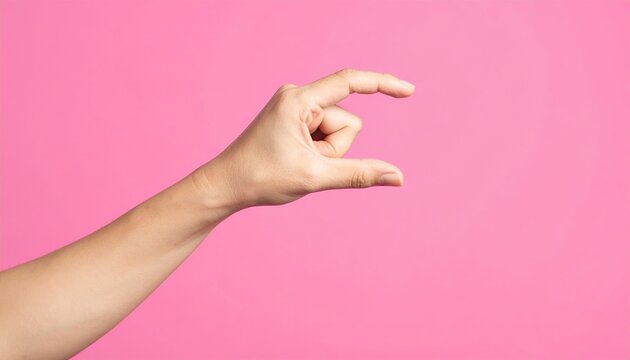 Hand snapping fingers on pink background