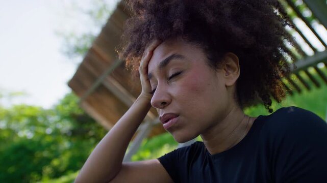 Woman Experiencing Hypertensive Crisis Symptoms Outdoors