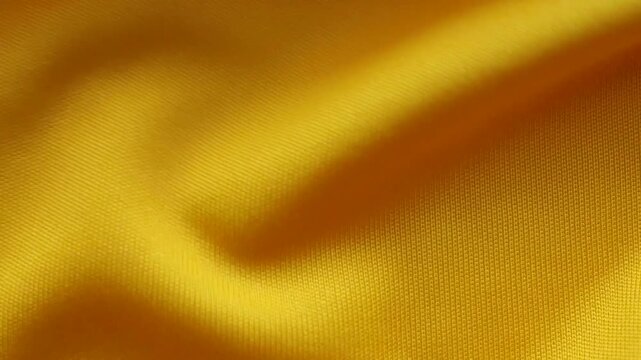 Yellow sports clothing fabric football shirt jersey texture close up