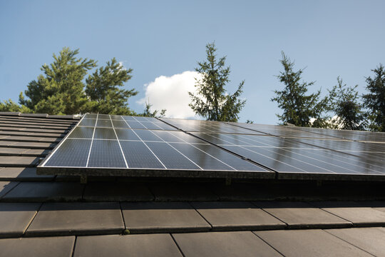 Photovoltaic panels on the house roof. Electricity generation.
