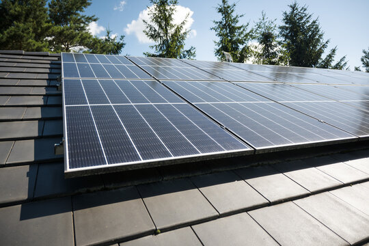 Photovoltaic panels on the house roof. Electricity generation.
