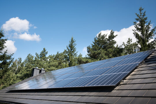 Photovoltaic panels on the house roof. Electricity generation.
