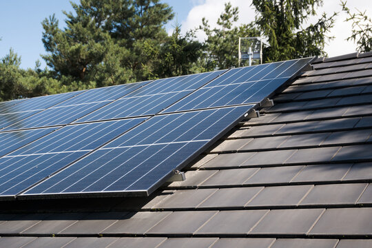 Photovoltaic panels on the house roof. Electricity generation.
