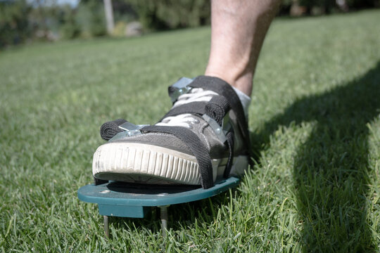 Lawn aeration using shoe attachments.
