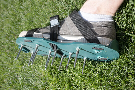 Lawn aeration using shoe attachments.
