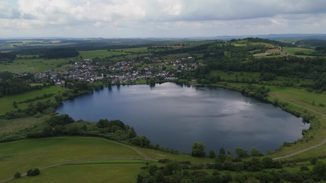 Deep Blue Volcanic Maar Lake Surrounded by Meadows