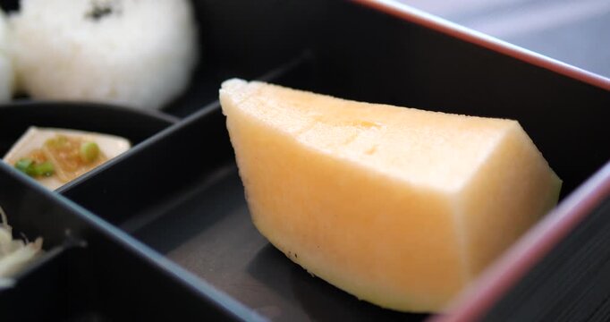 Close up of fresh Japanese melon dessert in a bento box