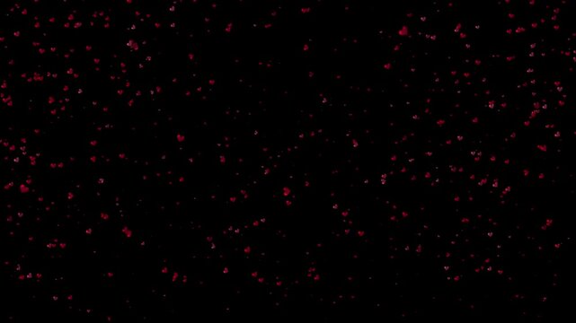Animated little hearts appearing on a black background