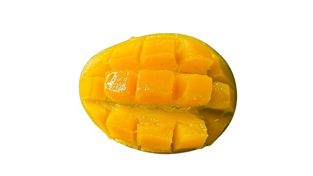 Vibrant fresh mango half expertly scored into juicy cubes on white background