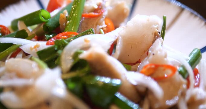 Close up of spicy Thai pork salad Yum Moo Yor
