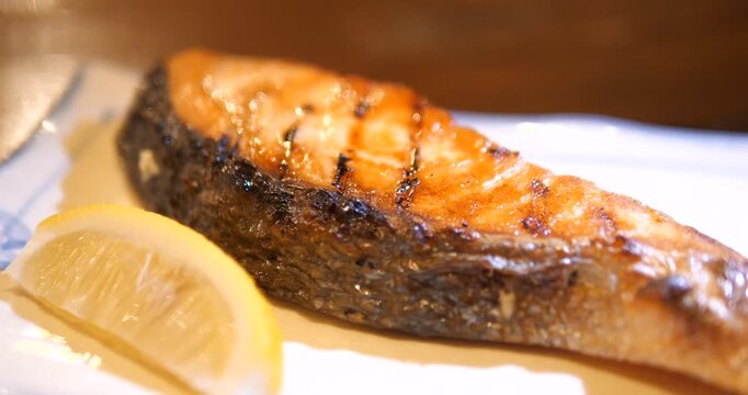 Close up of Japanese Grilled Salmon Teriyaki with rice and miso soup