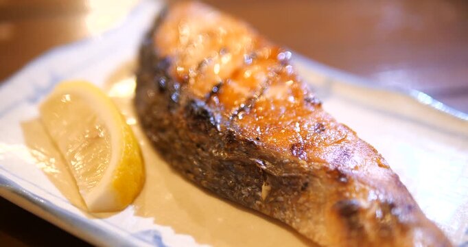 Close up of Japanese Grilled Salmon Teriyaki with rice and miso soup