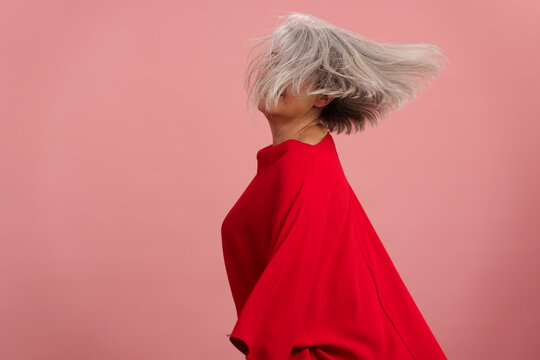 Active mature woman with gray hair having fun