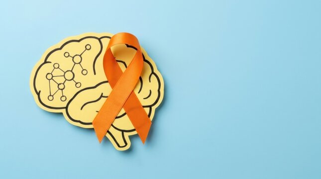 Multiple sclerosis awareness concept with an orange ribbon and yellow paper brain cutout on a blue background, representing neurological health support and medical research advocacy for patients now!!