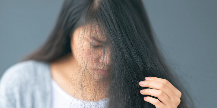 Young woman with disheveled hair close up portrait with shallow depth of field adult female